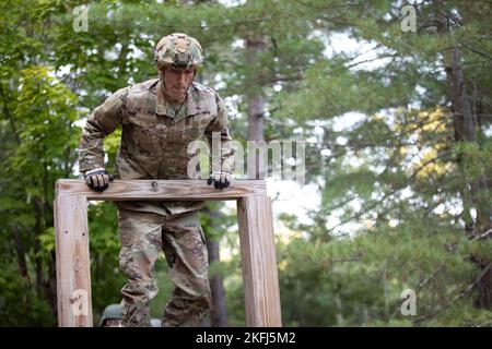 Staff Sgt. Jacob Kelly, a member of 157th Security Forces Squadron, competes in the obstacle course component of the New Hampshire Army National Guard Ranger Assessment at the Edward Cross Training Center in Pembroke, New Hampshire Sep. 17, 2022. Kelly was one of three Airmen who participated alongside soldiers of the NHARNG and was selected to attend the Ranger Training Assessment Course at Fort Benning, Georgia, after finishing within the top three competitors in the NHARNG Ranger Assessment. Stock Photo