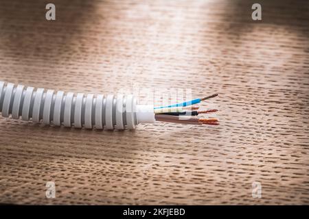 Electric cable in corrugated pipe Stock Photo