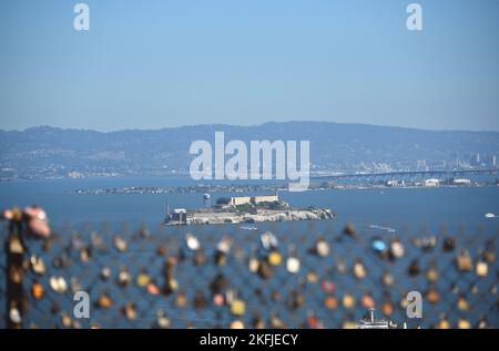 Large format, panoramic overview of the San Francisco bay featuring foreground lovelocks, Alcatraz island, Treasure island, and the Bay bridge. Stock Photo