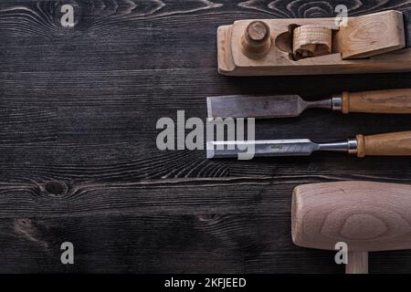 Flat chisels lump hammer shaving plane construction concept. Stock Photo