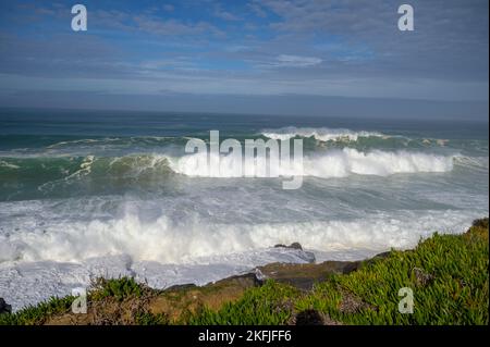 Magoito Beach on Atlantic ocean during storm and high waves, beautiful sandy beach on Sintra coast, Lisbon district, Portugal, part of Sintra-Cascais Stock Photo