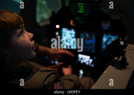 Seth Wilkey, Pilot for a Day, flies a T-6B Texan simulator on Naval Air Station Corpus Christi, Sept. 20. Pilot for a Day is a public outreach program between Training Squadron 35 and Driscoll Children's Hospital where children experience a day in the life of a Naval Aviator. Stock Photo