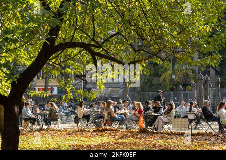 New Yorkers and tourists enjoying a sunny autumn afternoon in Madison Square, Park, flatiron District, 2022, NYC, USA