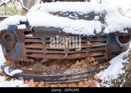 Old rusted truck in the woods on a snowy morning. Stock Photo