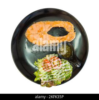 Die cut of Salmond steak with mix salad mayonnaise on white isolated. Stock Photo