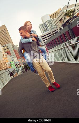 Romantic Couple Enjoying Piggyback Ride in Nature Stock Photo - Alamy