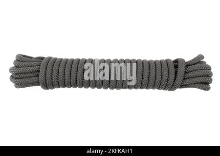 Coiled nylon rope isolated on white background. Striped nylon rope isolated. A coil of new colored rope. Stock Photo