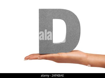 Have a nice Day. A young woman holding a capital letter D isolated on a white background. Stock Photo