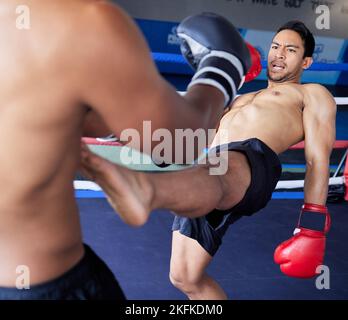 Boxer, fight and sports competition with men in boxing ring for exercise, workout and martial arts workout at a fitness club. Athlete man in action Stock Photo