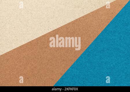 Texture of old craft beige, brown and turquoise color paper background, macro. Structure of vintage abstract blue cardboard with gradient and rainbow Stock Photo