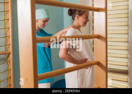 Pregnant woman trying to breath to soothe the pain of her labor contractions Stock Photo