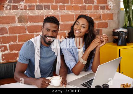 Having a laugh over some coffee. a young couple enjoying each others company. Stock Photo