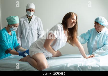 Child birth process, helping personal during labour Stock Photo