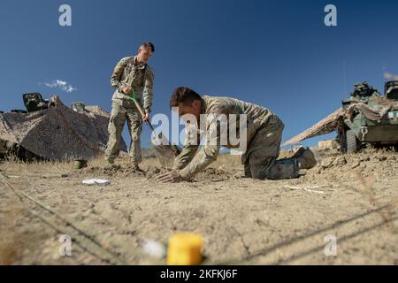 Ivy Soldiers assigned to 4th Battalion, 9th Infantry Regiment, 1st Stryker Brigade Combat Team, 4th Infantry Division, build an Army terrain model during a warfighter exercise, Sept. 24, 2022, at Fort Carson, Colorado. An Army terrain model is used to visualize an operation, ensuring everyone understands the plan to close in the final yards of the battlefield. Stock Photo