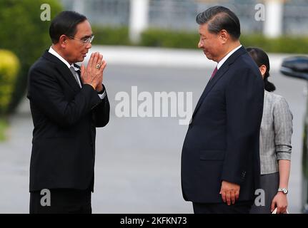 Chinese President Xi Jinping meets with Thai Prime Minister Prayuth Chan-O-Cha on the sidelines of the Asia-Pacific Economic Cooperation (APEC) summit in Bangkok during a welcoming ceremony at the Government House in Bangkok. Stock Photo