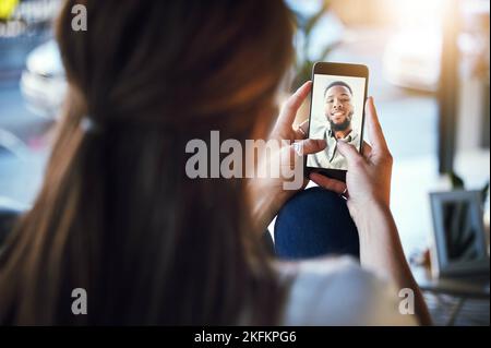 Phone, video call and woman speaking to man with zoom screen communication app with 5g network or home wifi connection. Black couple having virtual Stock Photo