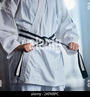 Karate, fitness and fighter with martial arts in the gym, sports motivation with black belt and defense training. Health, wellness and exercise with Stock Photo