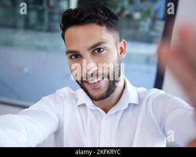 Businessman, portrait smile and selfie at the office for social media, profile or status update. Happy man employee face smiling in happiness for Stock Photo