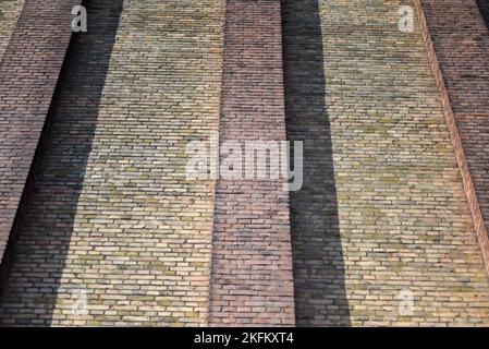 House wall made of different colored bricks in low angel Stock Photo