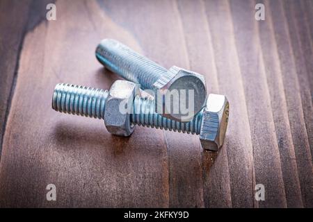 botls and nut on vintage wooden board construction concept Stock Photo