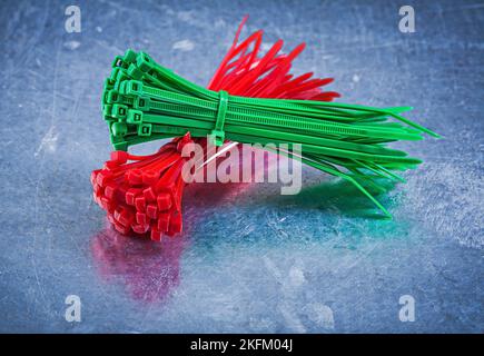 Cable ties on metallic background construction concept. Stock Photo