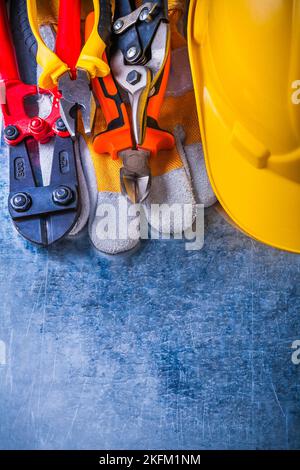 Collection of working tools on scratched vintage metallic background construction concept. Stock Photo