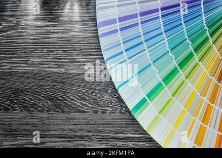 Color palette fan on wooden board top view. Stock Photo