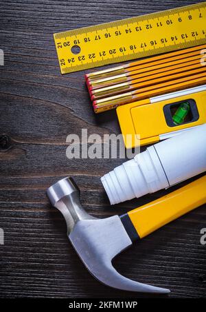 Composition of building objects for maintenance works on vintage wooden surface close up image construction concept. Stock Photo