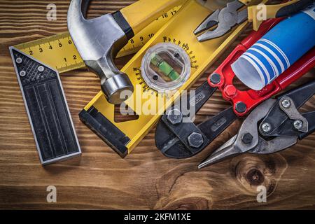 Composition of construction tools on wooden board directly above. Stock Photo