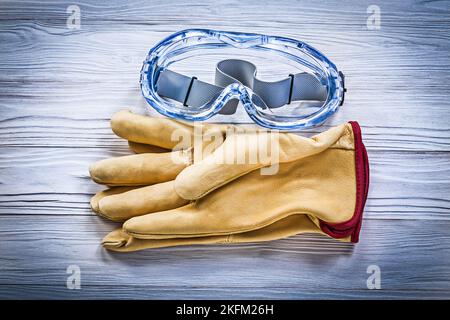 Composition of safety workwear on wooden board construction concept. Stock Photo