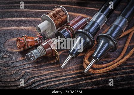 Composition of vintage electrical tools on wooden board electricity concept. Stock Photo