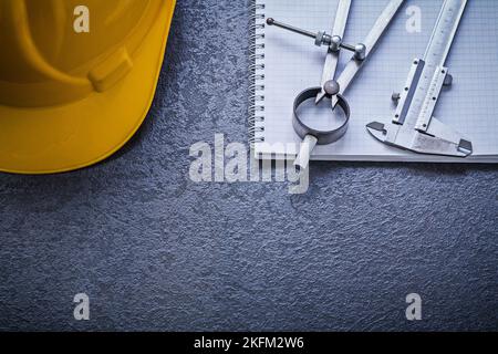 Copybook hard hat divider vernier scale construction concept. Stock Photo