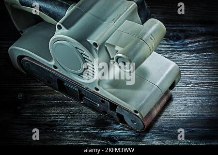 electric hand tool belt detail sander on vintage wood Stock Photo