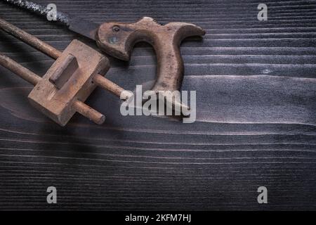 Messy rusted hand saw wooden marking gauge horizontal version. Stock Photo