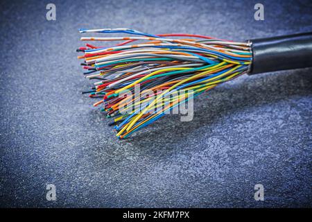 Multicolored electric cables on black background electricity concept. Stock Photo
