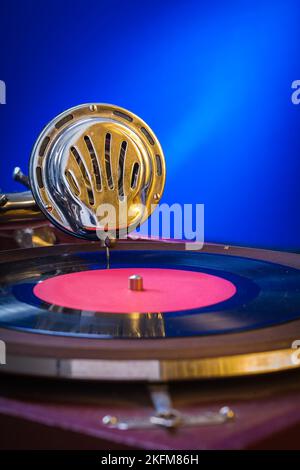 Old gramophone on blue background very close up Stock Photo