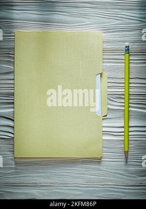 Office folder paper sheets pencil on wooden board. Stock Photo