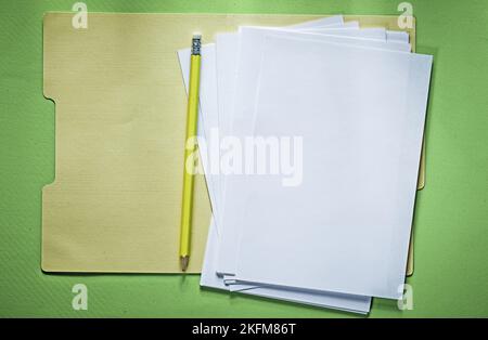 Manila folder paper sheets pencil on wooden board Stock Photo - Alamy