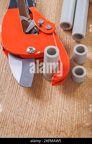 pipe cutter with cutted pipes Stock Photo