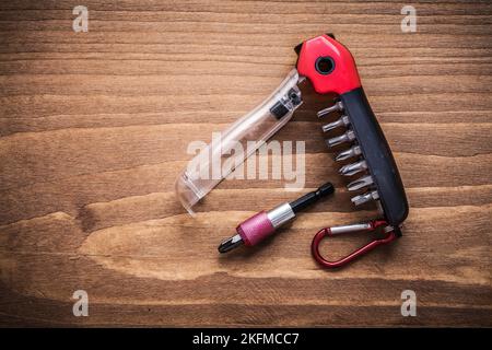 Replaceable turnscrew bits in toolbox on wooden board construction concept. Stock Photo