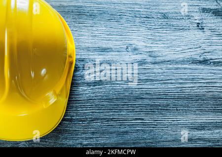 Safety cap on wooden board. Stock Photo