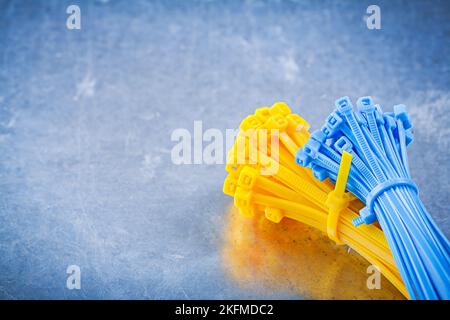 Set of cable ties on metallic background construction concept. Stock Photo