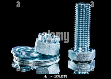 Set of crown nuts screwbolt spring washer on black background. Stock Photo