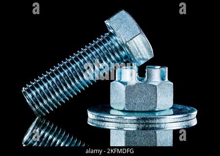 Set of crown nuts screwbolt bolt washer on black background. Stock Photo