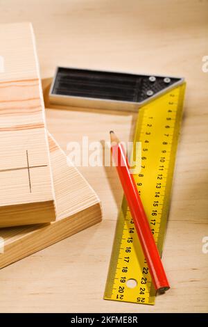 Set-square ruler and pencil with boards Stock Photo - Alamy