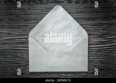 Vintage envelope on black board. Stock Photo