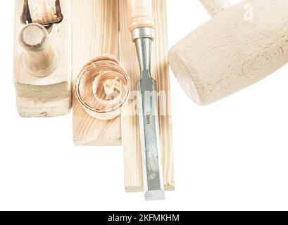 Wooden hammer bricks chisel shavings planer isolated on white. Stock Photo