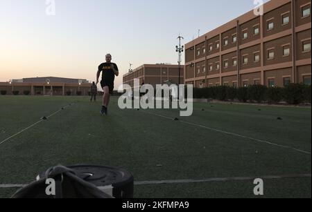 Capt. Ryan Finegan, intelligence officer, Area Support Group – Kuwait, runs during the sprint-drag-carry portion of the Army Combat Fitness Test (ACFT) at Camp Arifjan, Kuwait, Sept. 27, 2022. Stock Photo