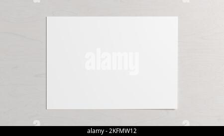 Blank sheet of paper mock up on the white wooden table Stock Photo