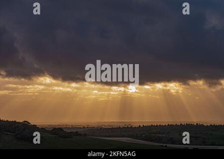 Dramatic sky as the sun sets over the south coast of Sussex and Hampshire, southern England, UK. Stock Photo